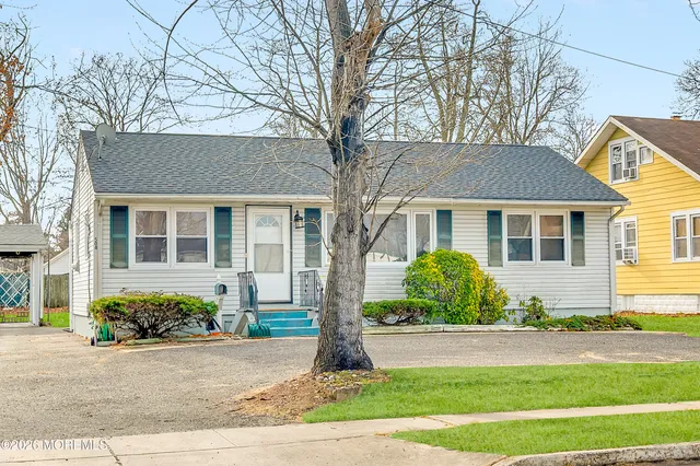a view of road with yard and trees