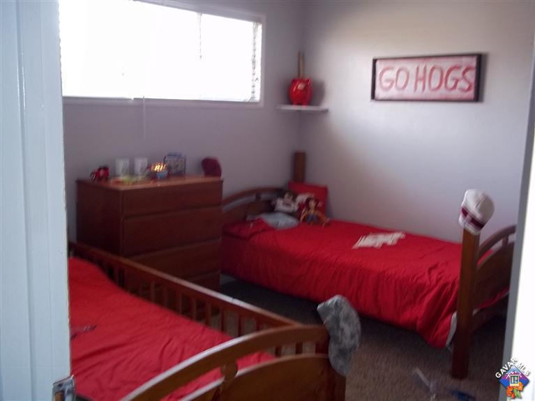 43940 3rd Street East Lancaster, CA 93535 - Photo 11 of 18 a bed room with a bed and a potted plant