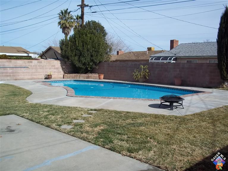 43940 3rd Street East Lancaster, CA 93535 - Photo 18 of 18 a front view of a house with a yard