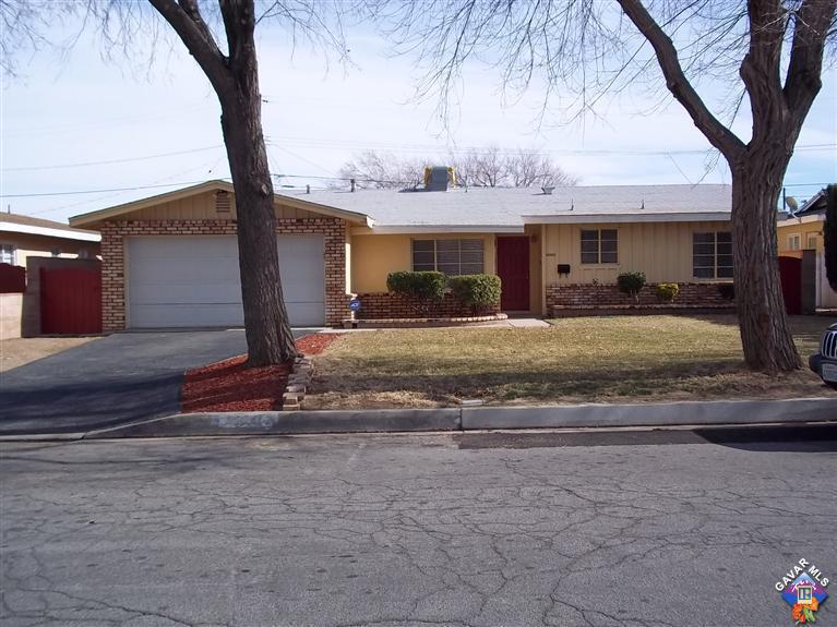 43940 3rd Street East Lancaster, CA 93535 - Photo 2 of 18 a view of a house with a tree in front of it