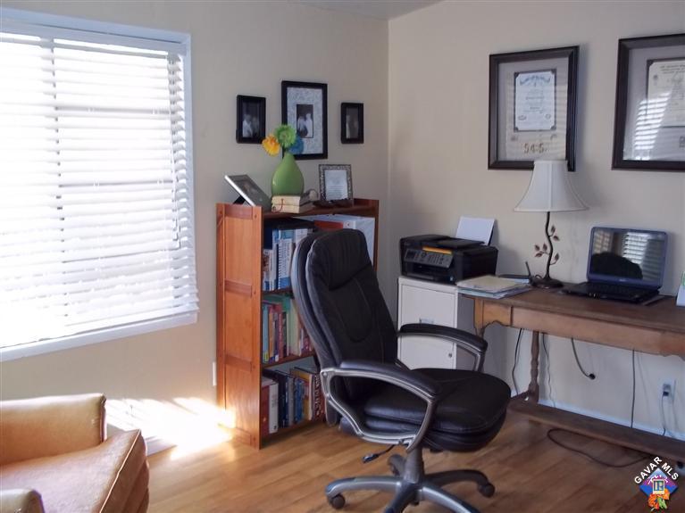 43940 3rd Street East Lancaster, CA 93535 - Photo 7 of 18 a view of a workspace with furniture and a window