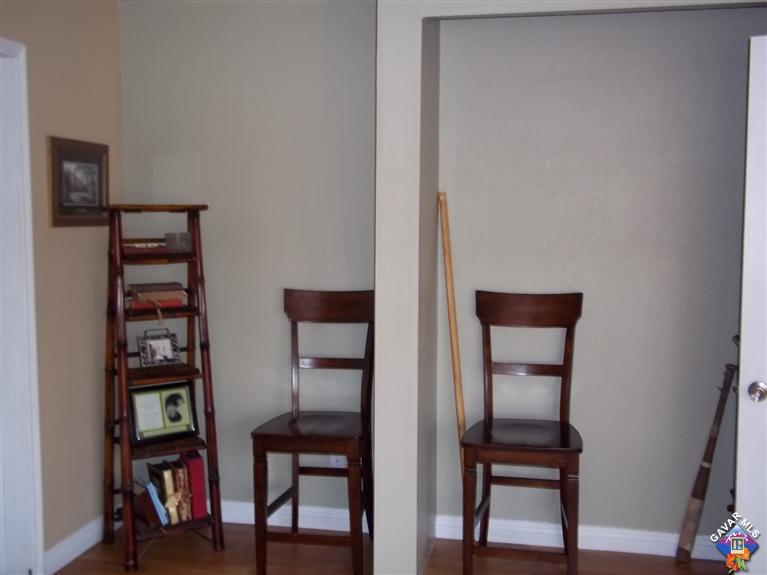 43940 3rd Street East Lancaster, CA 93535 - Photo 8 of 18 a view of a workspace room with furniture and wooden floor