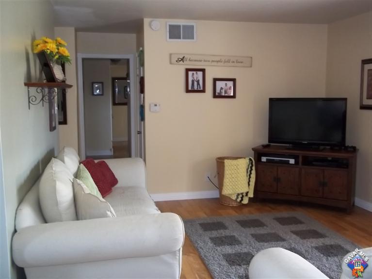 43940 3rd Street East Lancaster, CA 93535 - Photo 10 of 18 a living room with furniture and a flat screen tv