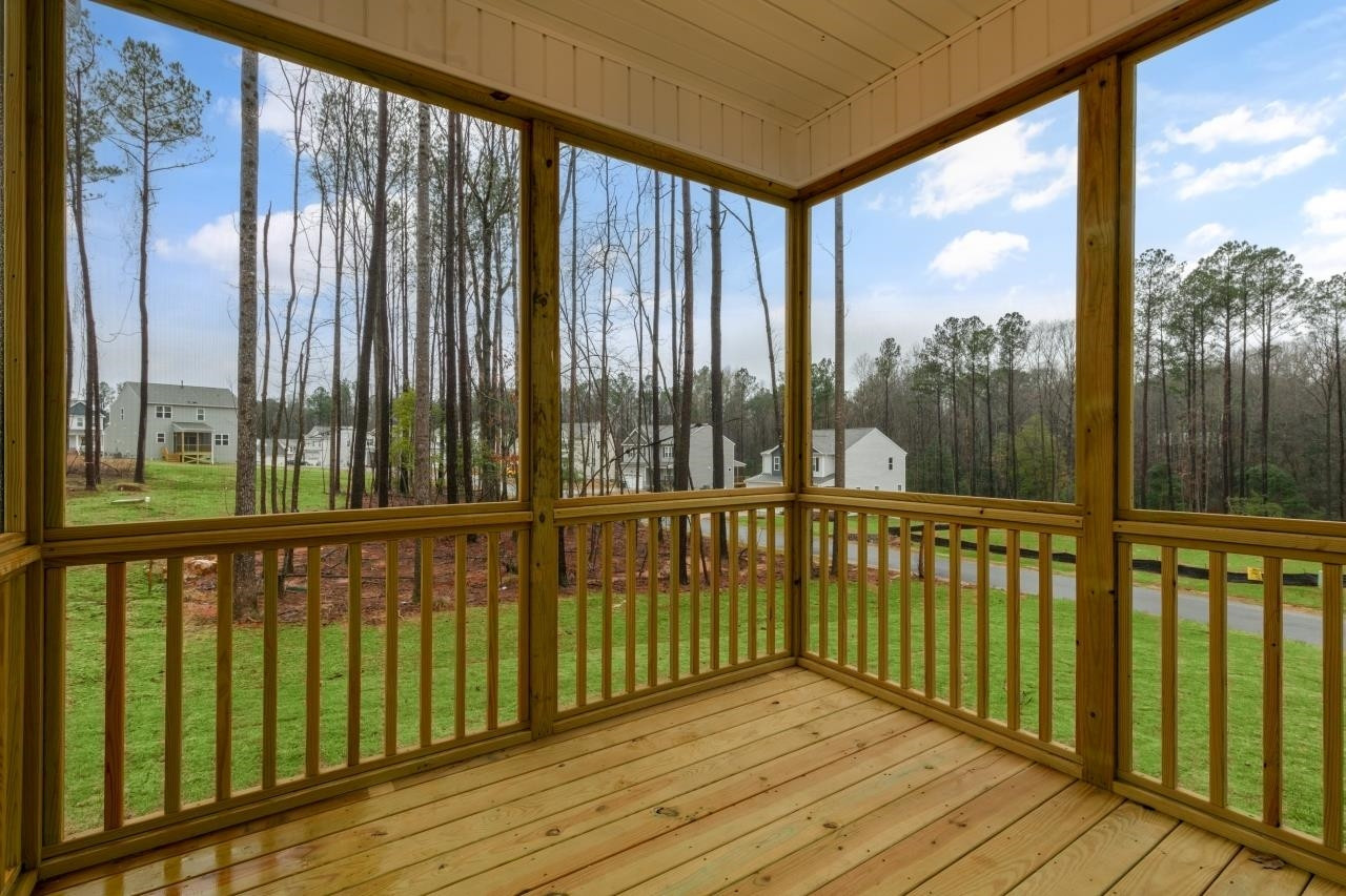 195 Madden Rose Loop Garner, NC 27529 - Photo 20 of 37 a view of a balcony with a floor to ceiling window