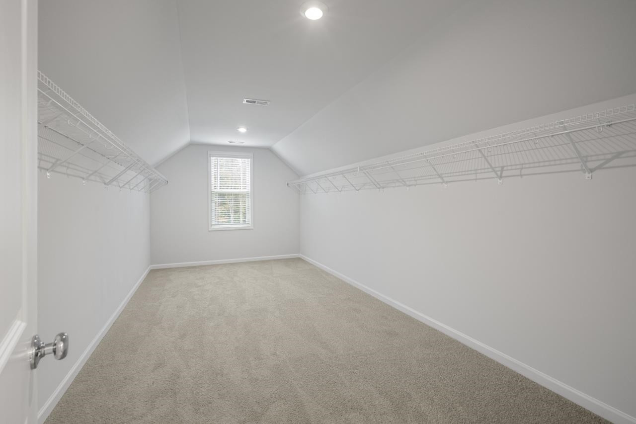 195 Madden Rose Loop Garner, NC 27529 - Photo 35 of 37 a view of an empty room and a window