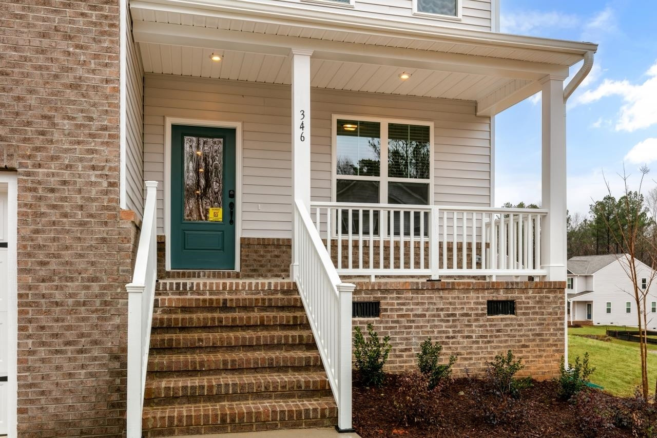 195 Madden Rose Loop Garner, NC 27529 - Photo 4 of 37 a front view of a house with a window