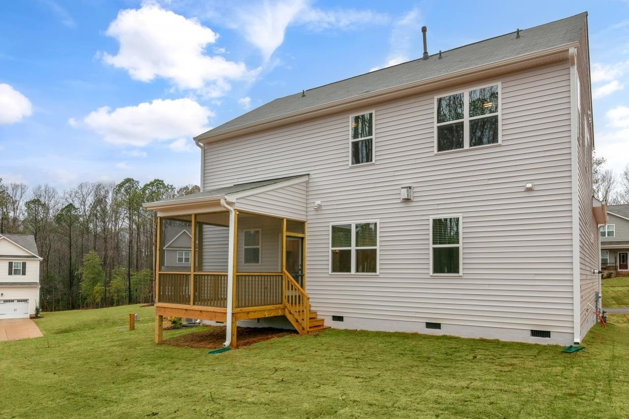195 Madden Rose Loop Garner, NC 27529 - Photo 5 of 37 a view of a house with a yard