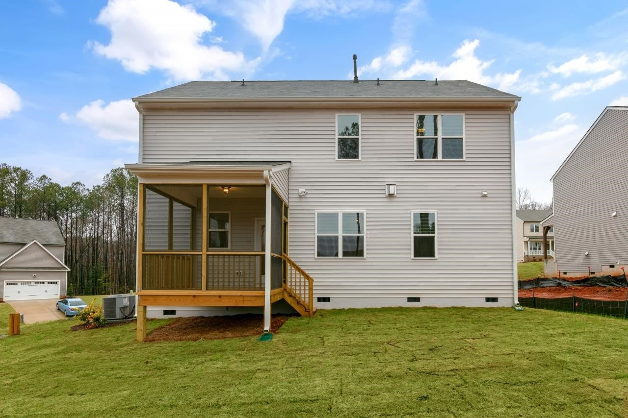 195 Madden Rose Loop Garner, NC 27529 - Photo 6 of 37 a view of a house with a backyard