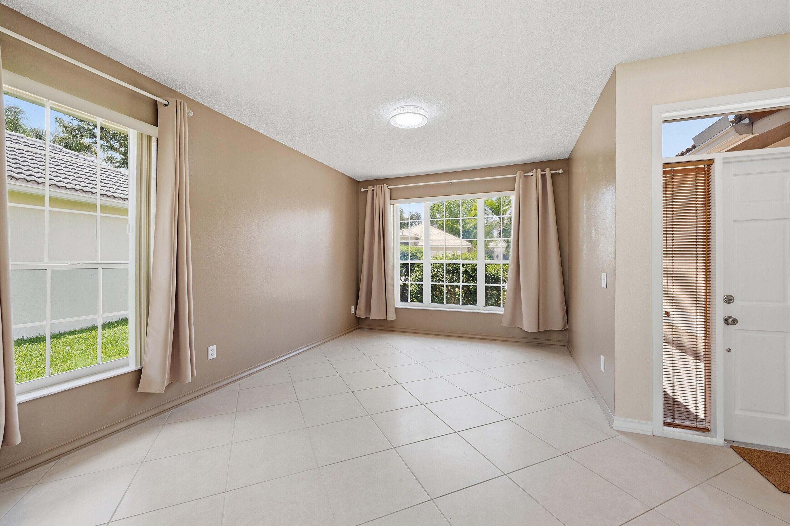 18474 Old Princeton Lane Boca Raton, FL 33498 - Photo 9 of 46 a view of an empty room with a window