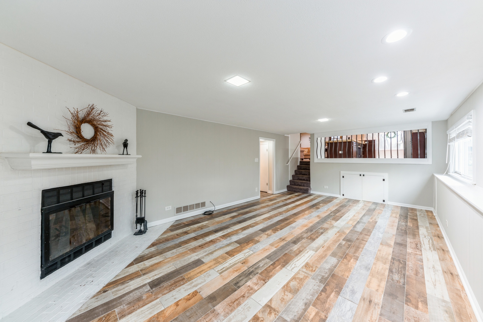 219 North Butterfield Road Libertyville, IL 60048 - Photo 7 of 14 a bedroom with a bed and a fireplace