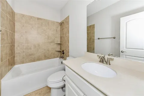 a bathroom with a sink toilet and bathtub