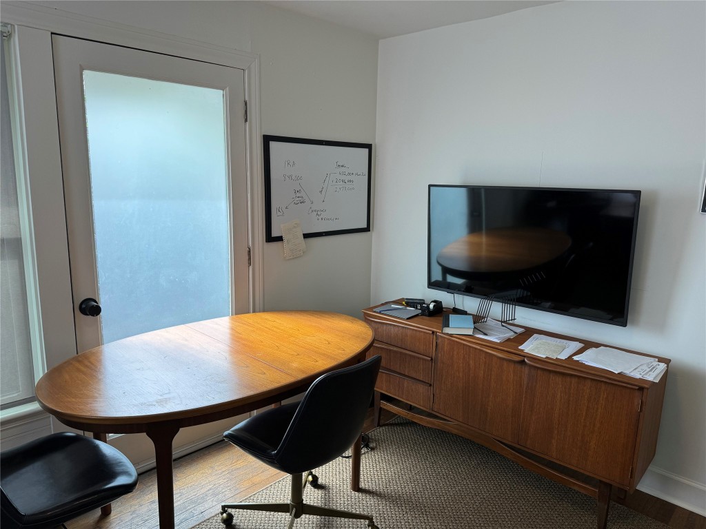 1308 Navasota Street Austin, TX 78702 - Photo 12 of 14 a living room with furniture and a flat screen tv