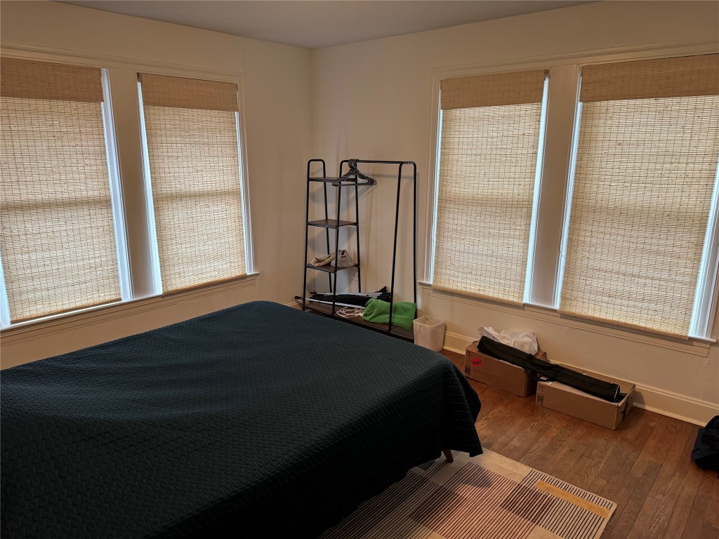 1308 Navasota Street Austin, TX 78702 - Photo 14 of 14 a bedroom with a bed and a window