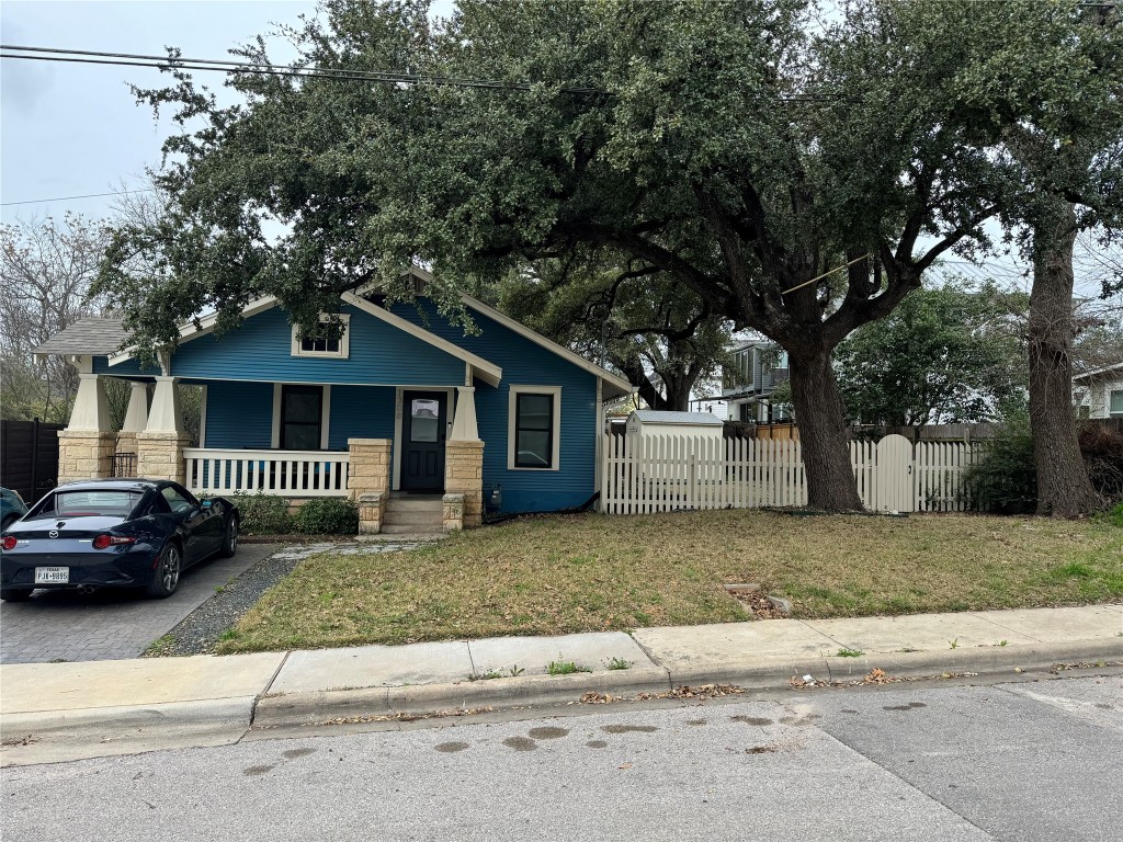 1308 Navasota Street Austin, TX 78702 - Photo 2 of 14 a front view of a house with a garden