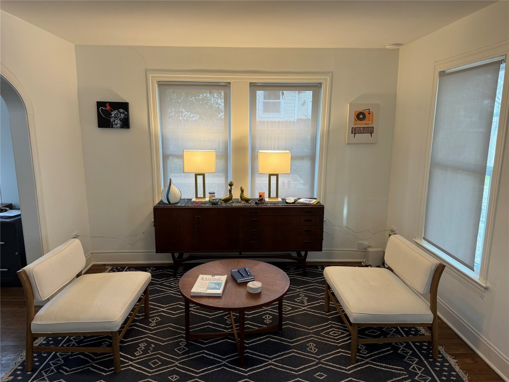 1308 Navasota Street Austin, TX 78702 - Photo 5 of 14 a bathroom with a toilet a sink and a mirror