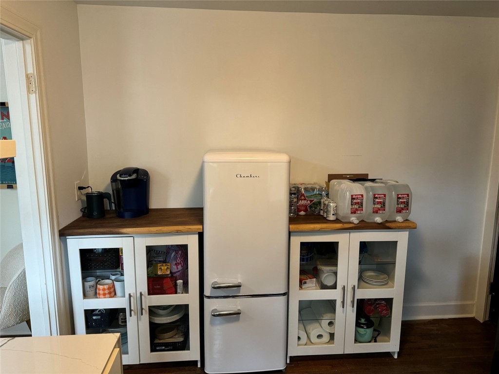 1308 Navasota Street Austin, TX 78702 - Photo 10 of 14 a view of a kitchen with fridge and rack