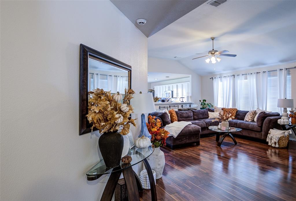 8817 King Ranch Drive Cross Roads, TX 76227 - Photo 13 of 24 a living room with furniture potted plant and a chandelier