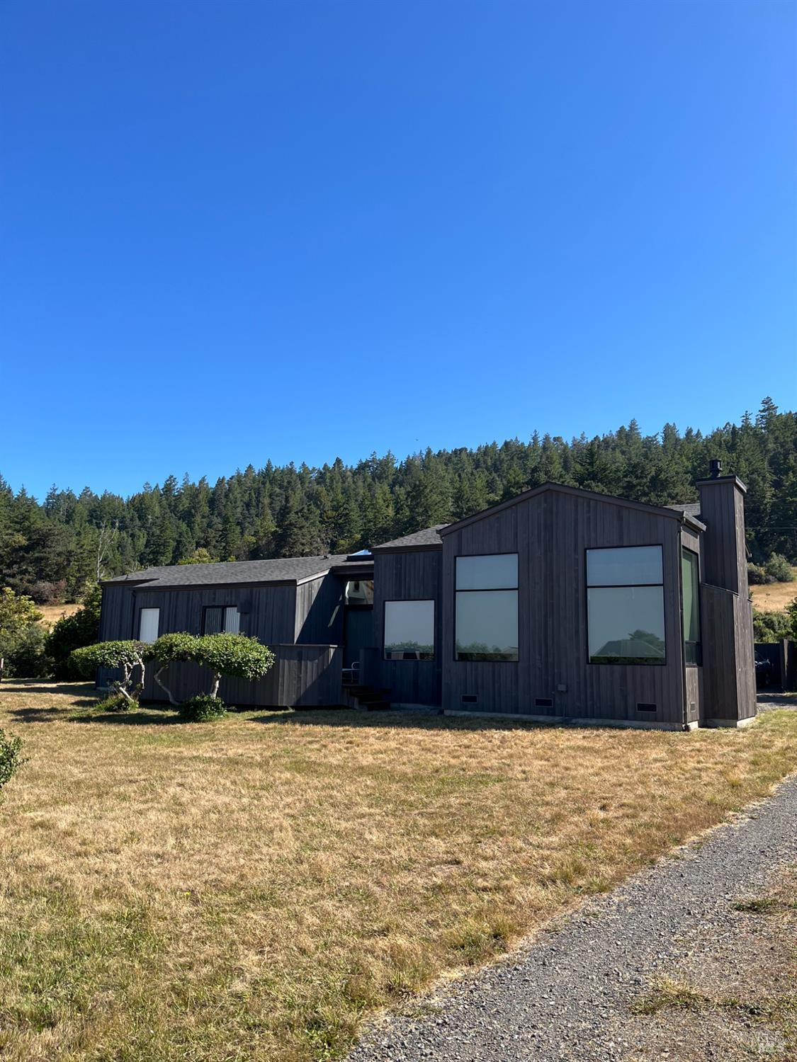 39722 Leeward Road, Unit 28 The Sea Ranch, CA 95497 - Photo 16 of 36 a front view of a house with a yard