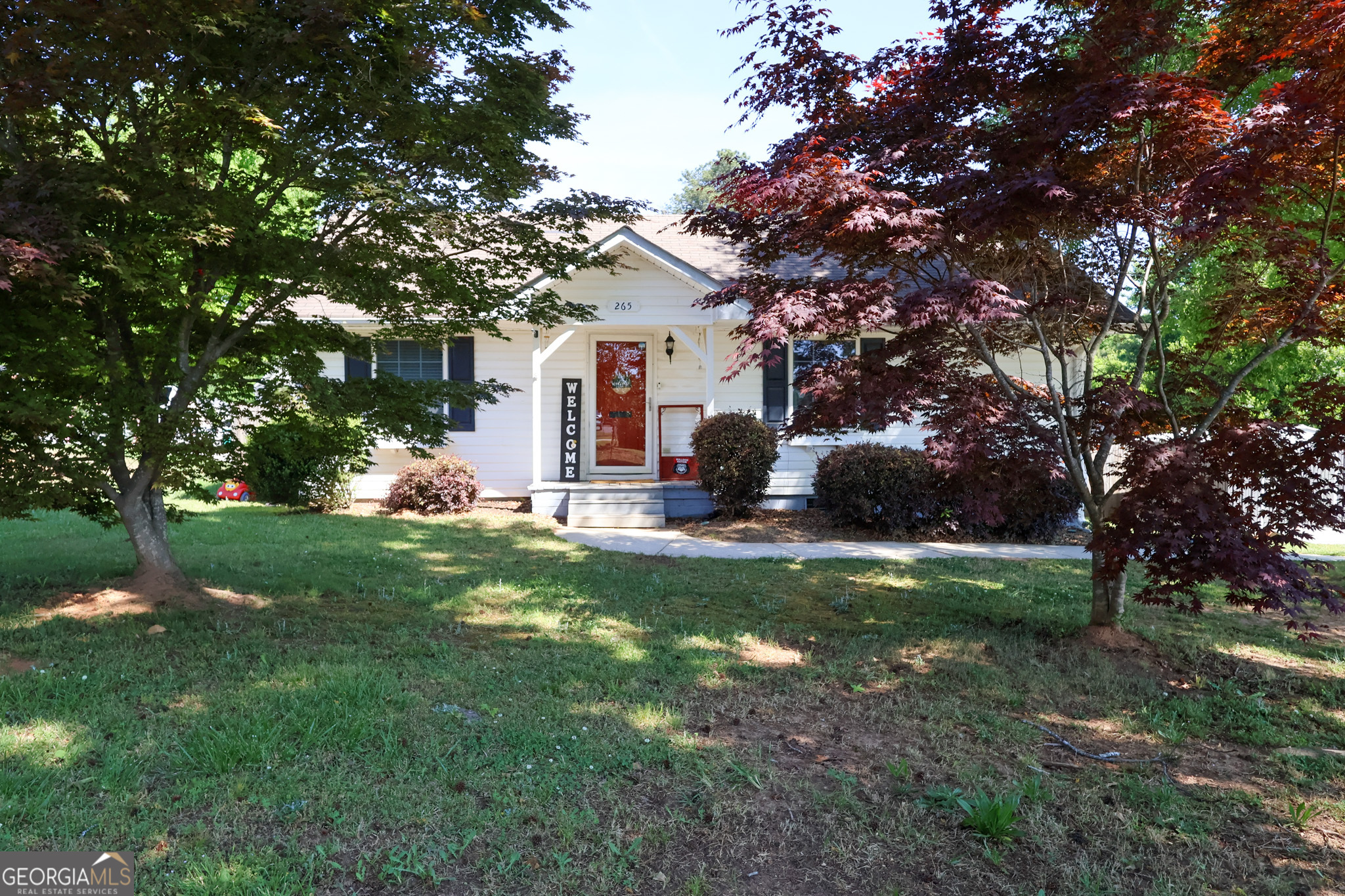 265 Club Drive Locust Grove, GA 30248 - Photo 14 of 20 a front view of house with yard and green space