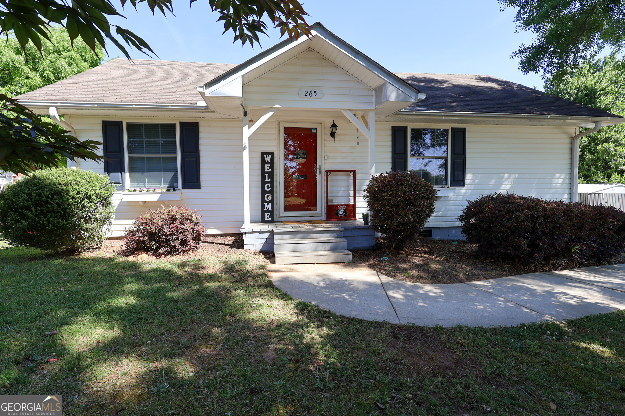265 Club Drive Locust Grove, GA 30248 - Photo 15 of 20 a front view of a house with garden