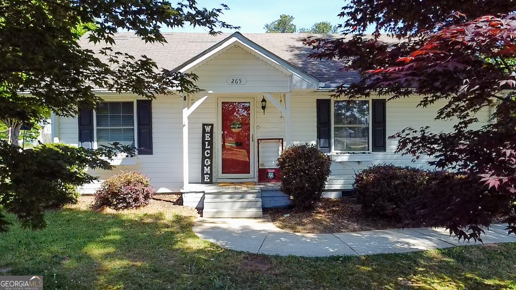265 Club Drive Locust Grove, GA 30248 - Photo 17 of 20 a front view of a house with garden