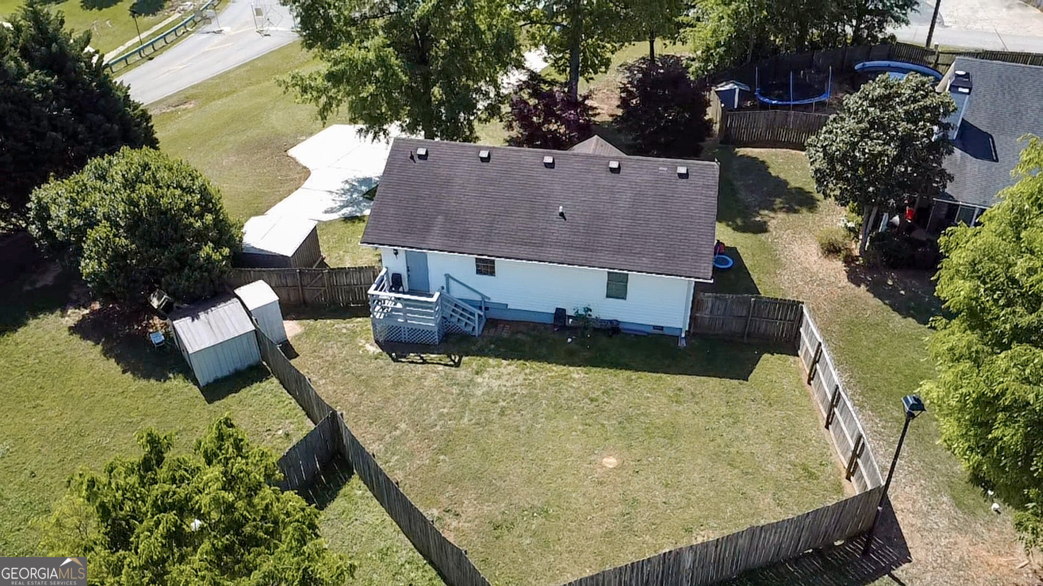 265 Club Drive Locust Grove, GA 30248 - Photo 18 of 20 a view of a house with a yard potted plants