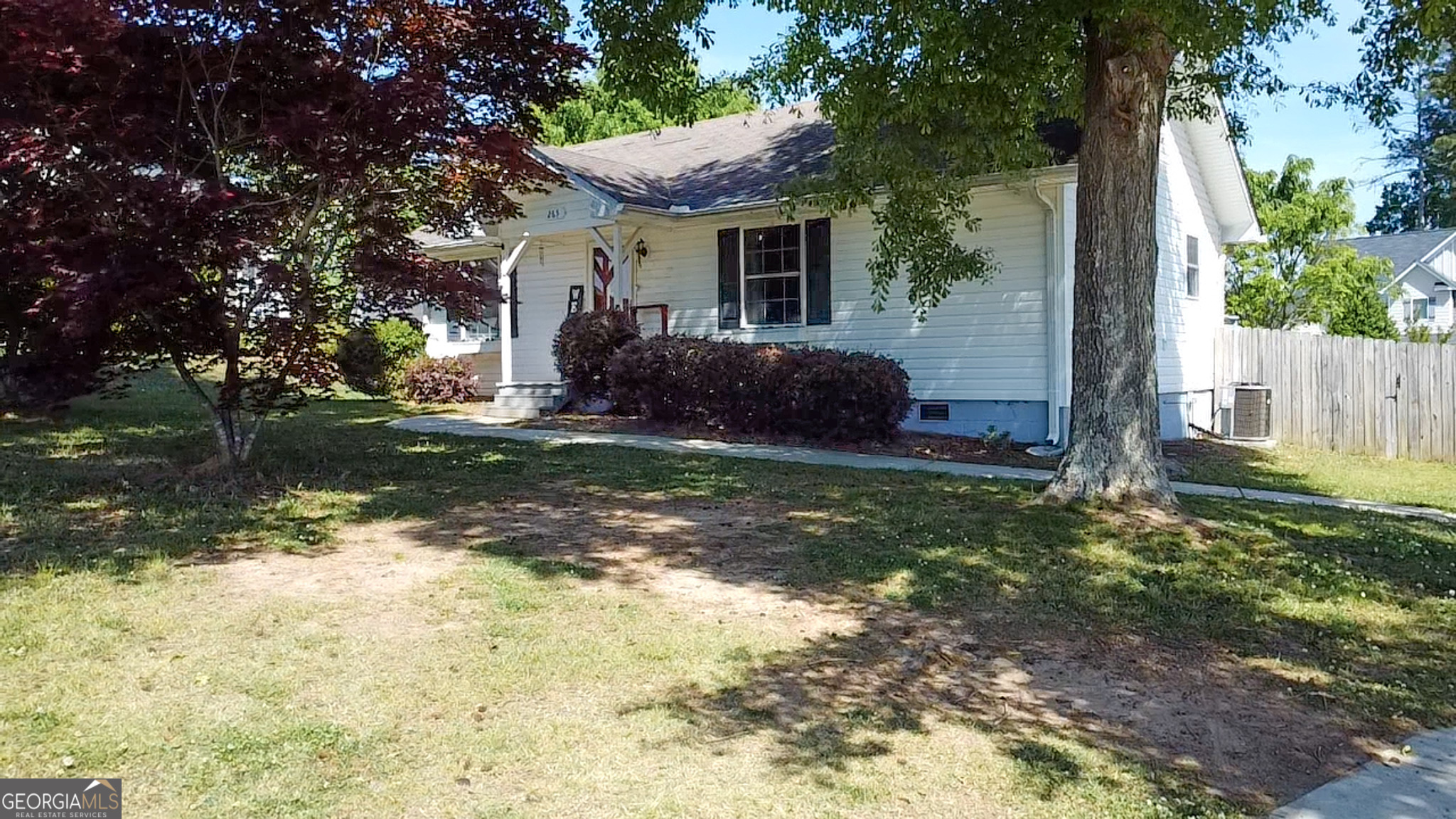 265 Club Drive Locust Grove, GA 30248 - Photo 19 of 20 a view of a house with backyard and garden