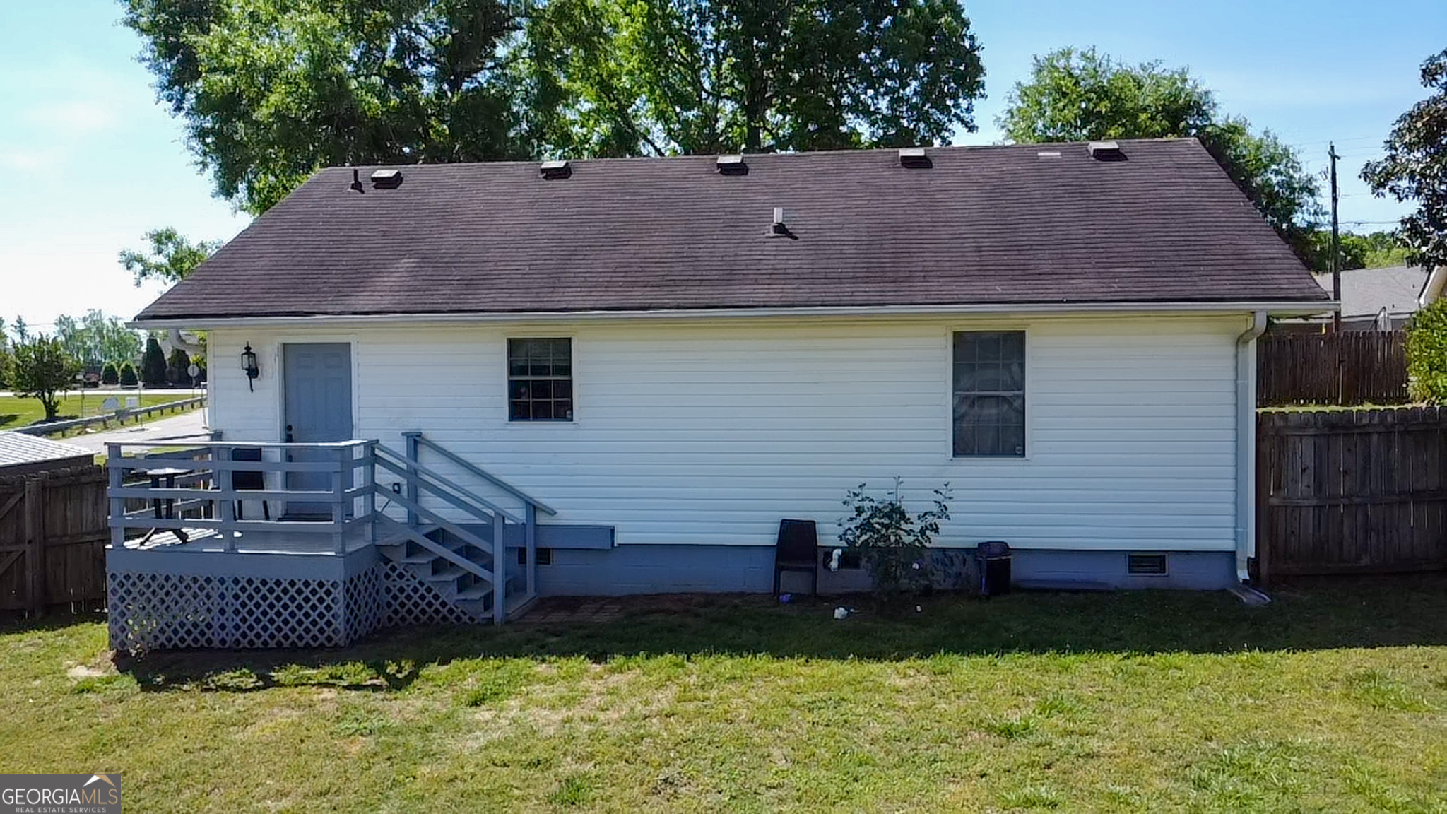 265 Club Drive Locust Grove, GA 30248 - Photo 20 of 20 a view of a house with a yard and sitting area
