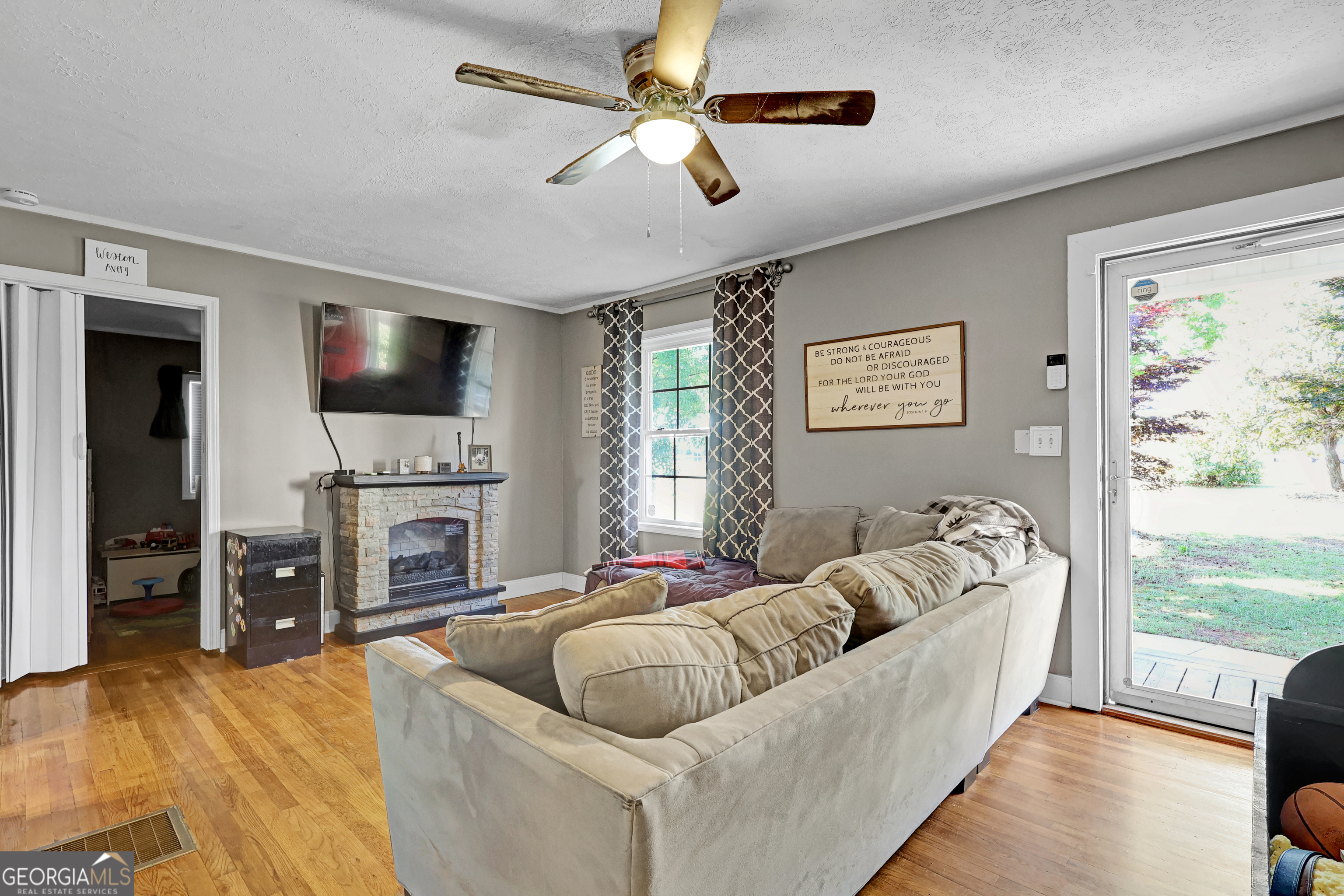 265 Club Drive Locust Grove, GA 30248 - Photo 2 of 20 a living room with furniture fireplace and flat screen tv
