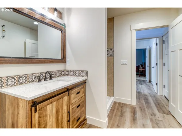 a bathroom with a sink and a mirror