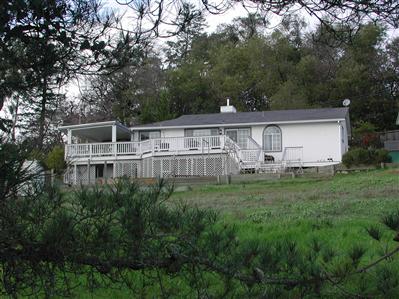 10837 Cherry Ridge Road Sebastopol, CA 95472 - Photo 1 of 4 a view of a house with backyard and garden