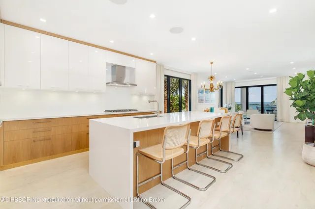 a living room with furniture a flat screen tv and a table