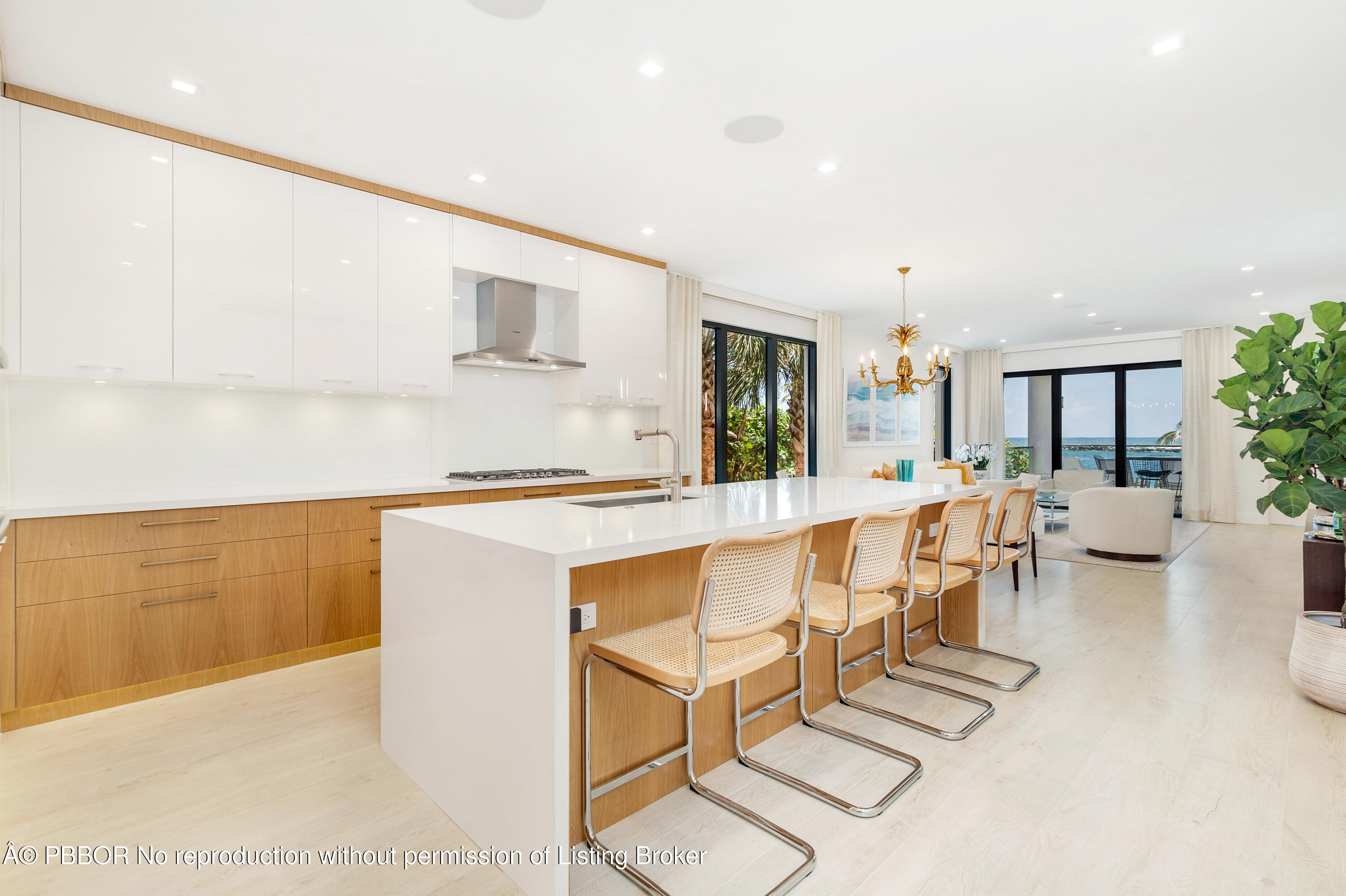 150 Inlet Way, Unit 1E Palm Beach Shores, FL 33404 - Photo 11 of 41 a living room with furniture a flat screen tv and a table