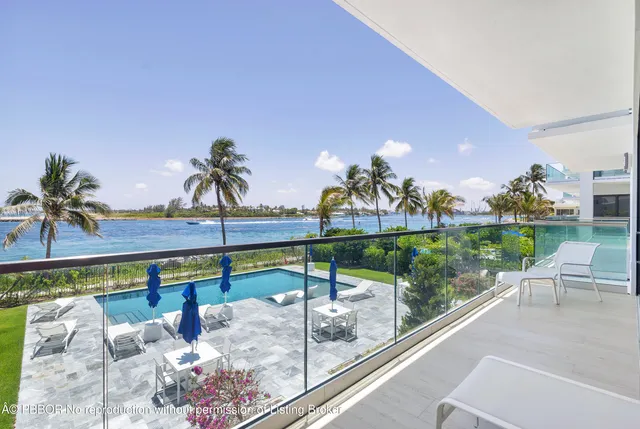 a view of swimming pool with outdoor seating