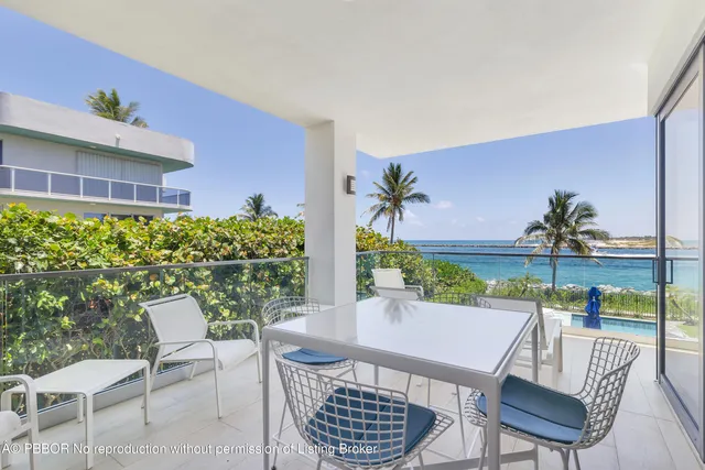 a view of a chairs and table in patio