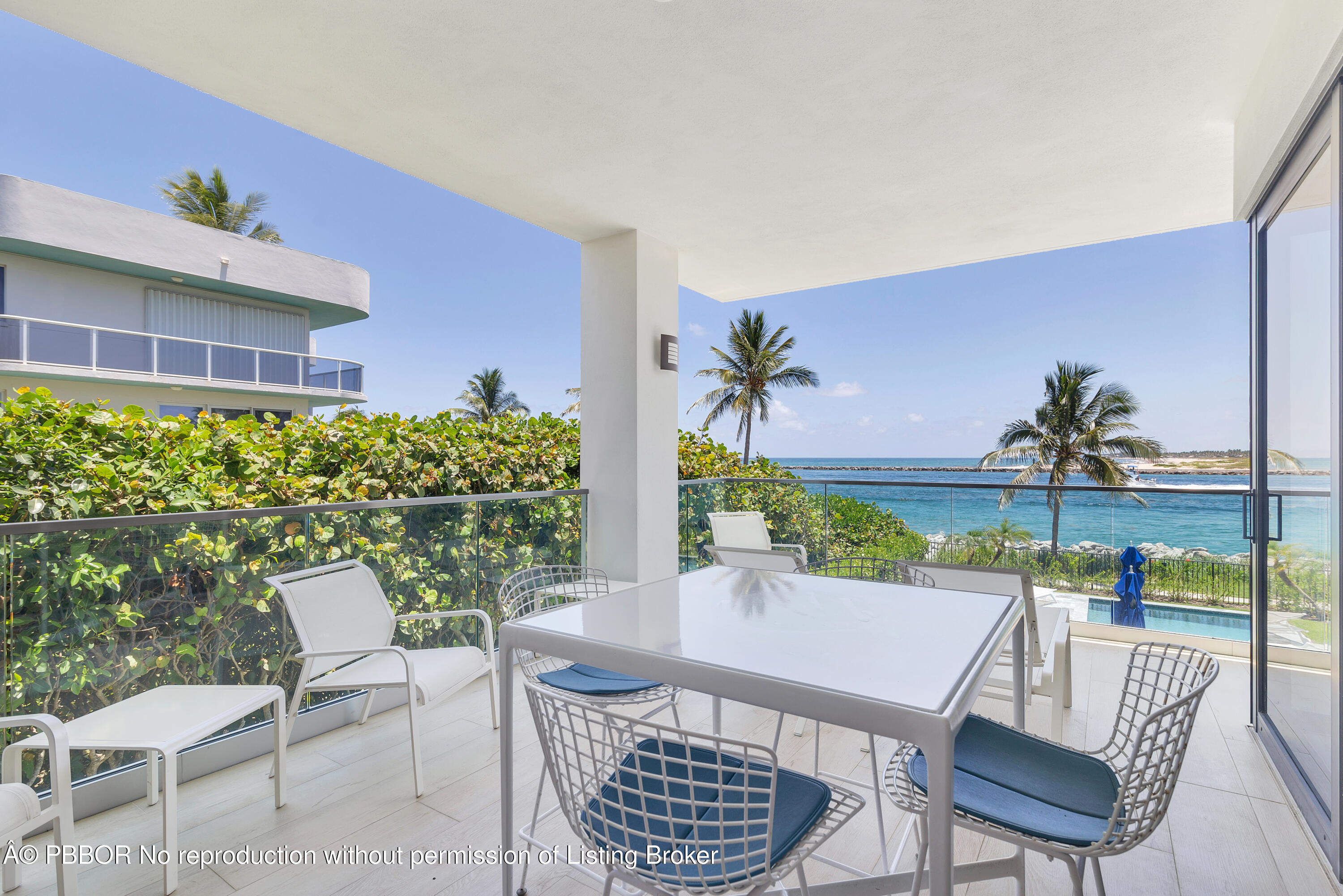 150 Inlet Way, Unit 1E Palm Beach Shores, FL 33404 - Photo 30 of 41 a view of a chairs and table in patio
