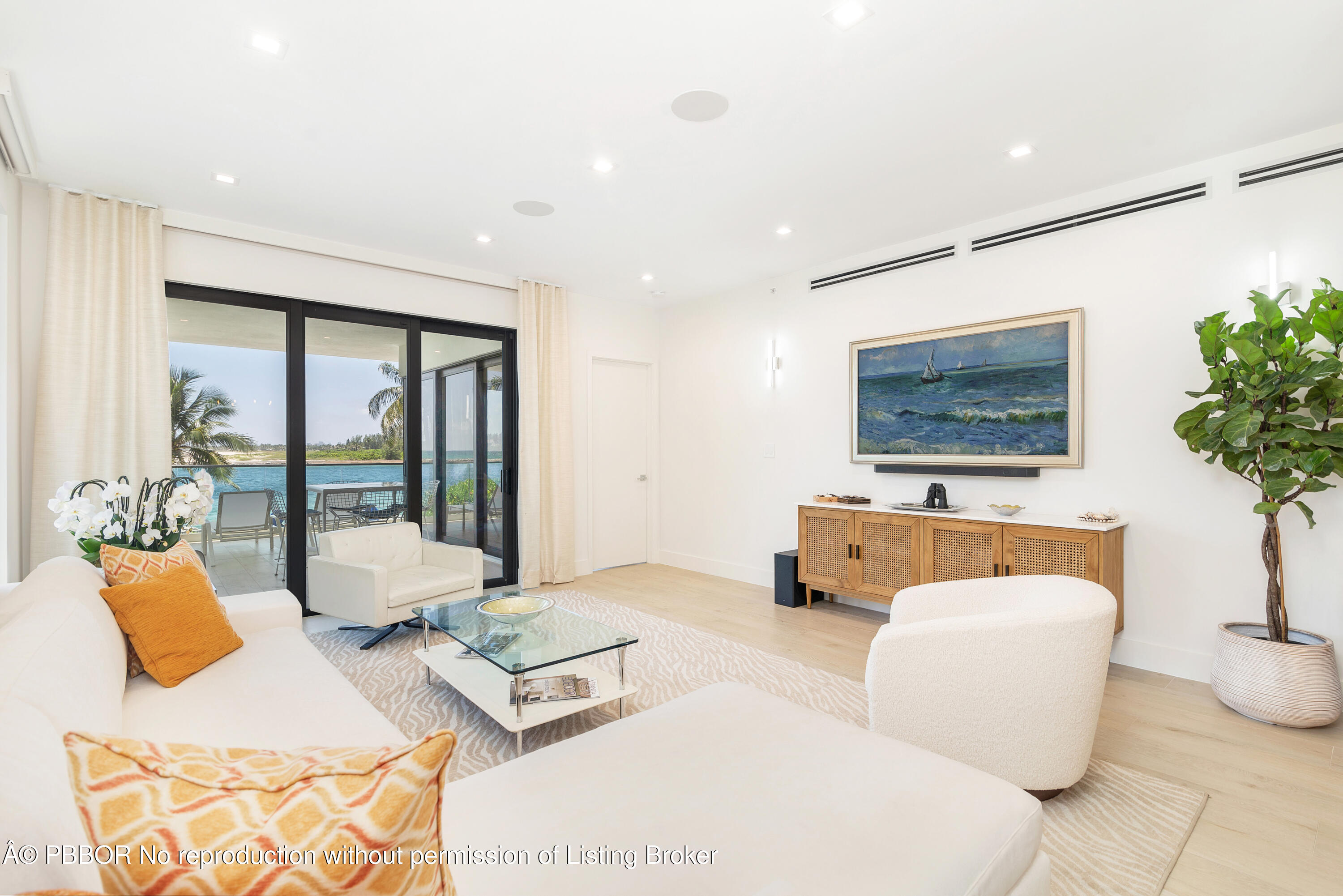 150 Inlet Way, Unit 1E Palm Beach Shores, FL 33404 - Photo 3 of 41 a living room with furniture and a large window