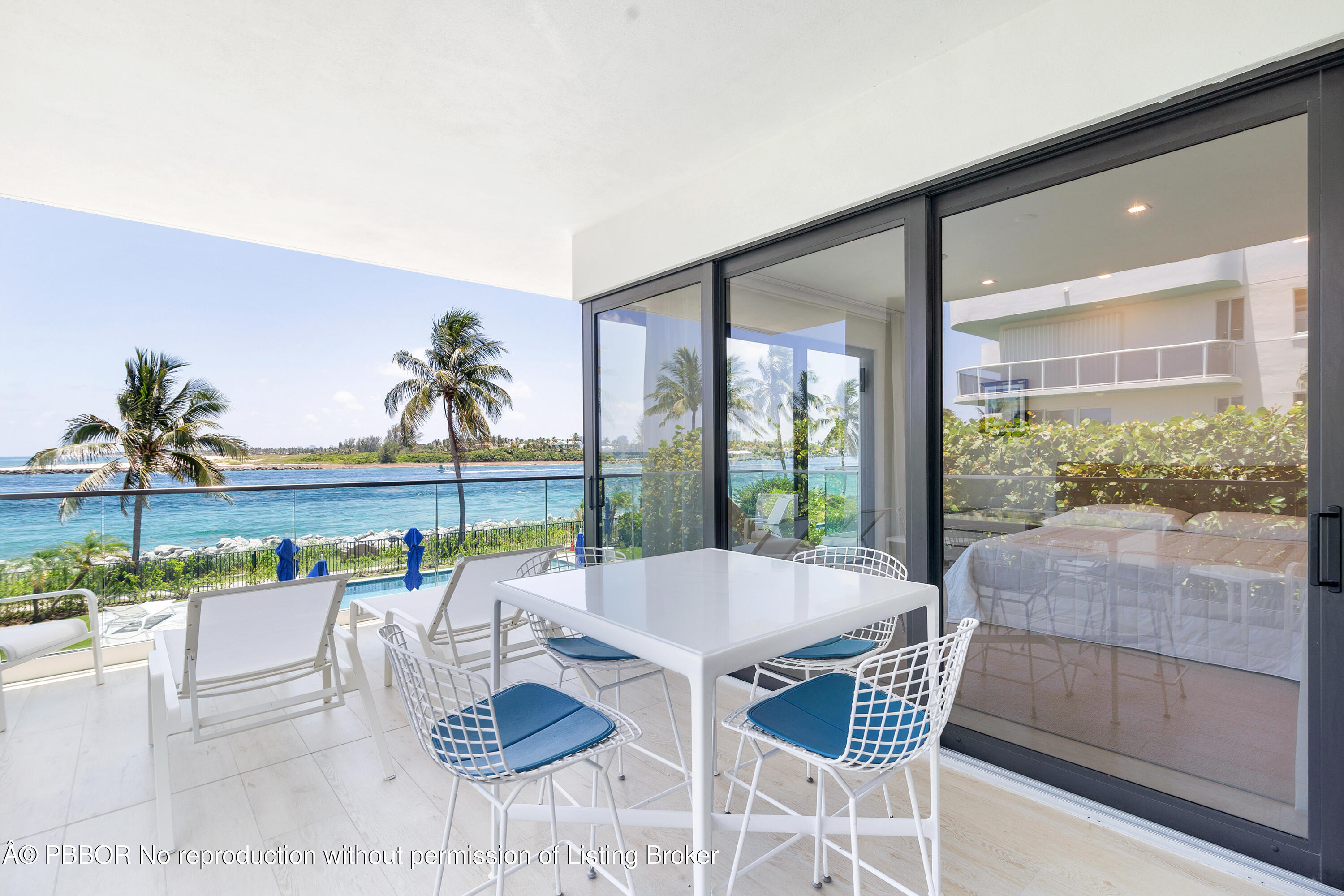 150 Inlet Way, Unit 1E Palm Beach Shores, FL 33404 - Photo 31 of 41 a living room with furniture and a large window