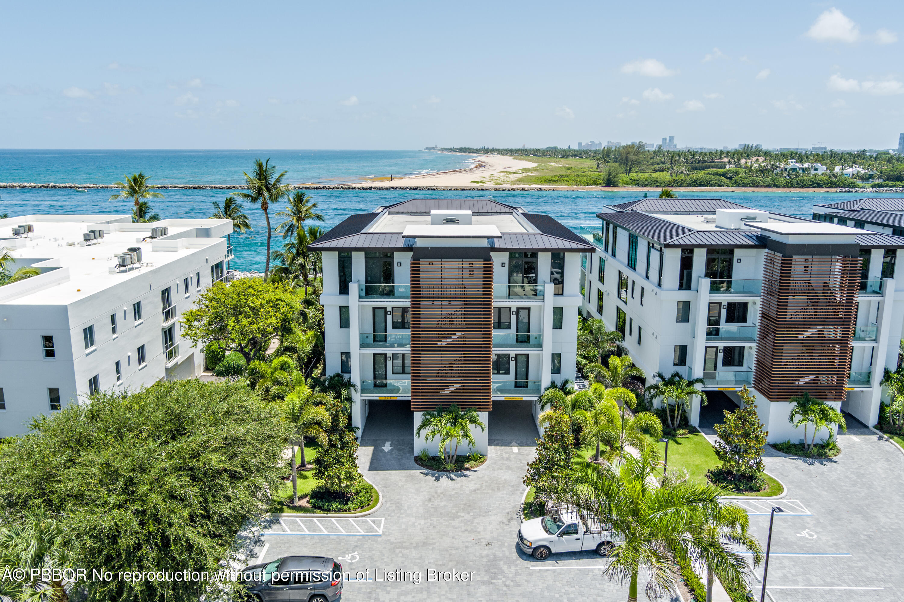 150 Inlet Way, Unit 1E Palm Beach Shores, FL 33404 - Photo 35 of 41 a aerial view of a house with a yard and potted plants
