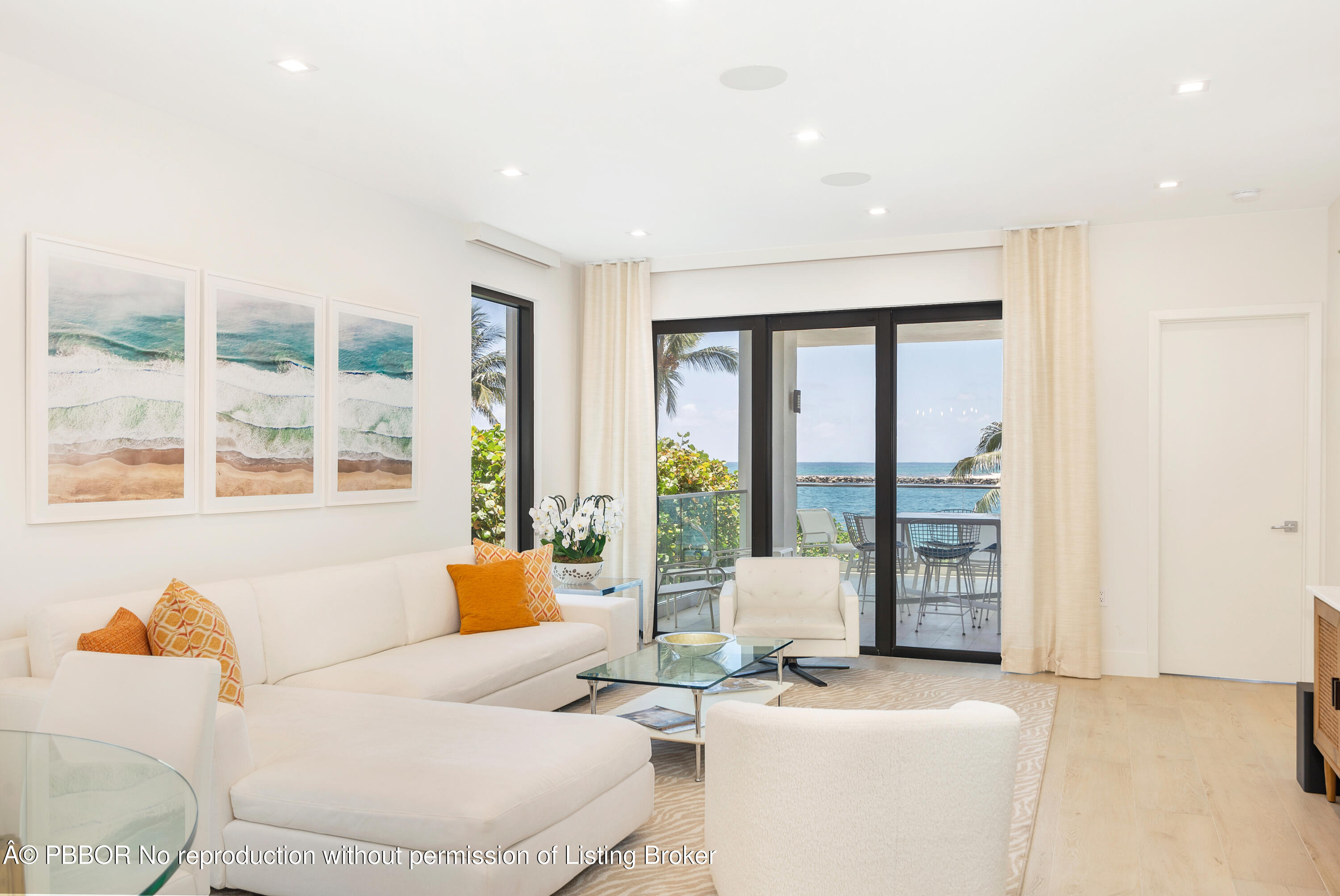 150 Inlet Way, Unit 1E Palm Beach Shores, FL 33404 - Photo 6 of 41 a living room with furniture and large windows