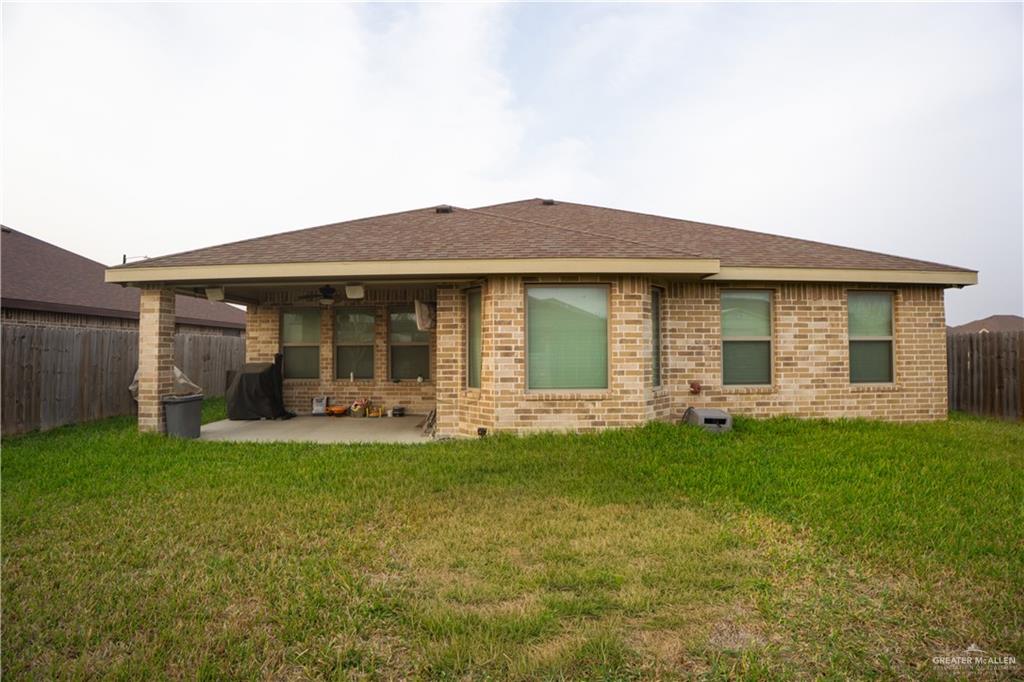 8725 Spoonbill Street Harlingen, TX 78552 - Photo 11 of 18 front view of a house with a yard