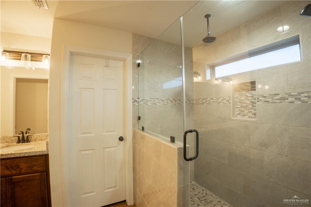 8725 Spoonbill Street Harlingen, TX 78552 - Photo 12 of 18 a bathroom with a shower