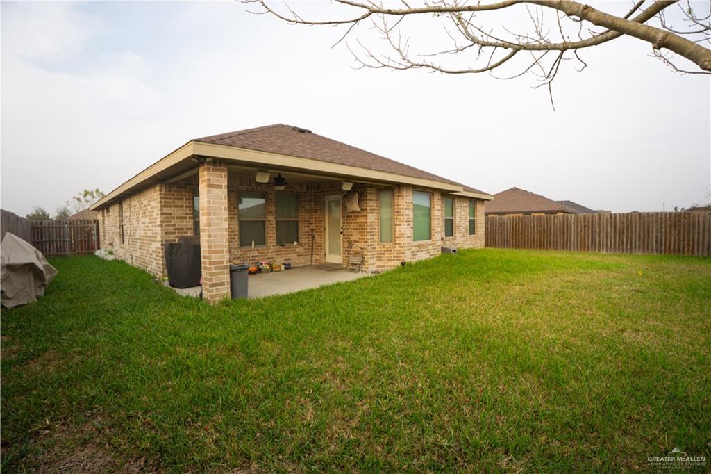 8725 Spoonbill Street Harlingen, TX 78552 - Photo 13 of 18 a front view of house with yard and seating