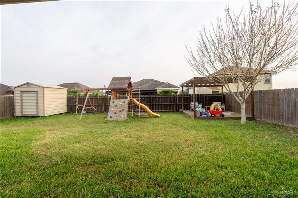 8725 Spoonbill Street Harlingen, TX 78552 - Photo 14 of 18 a view of a house with backyard