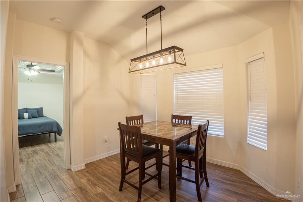 8725 Spoonbill Street Harlingen, TX 78552 - Photo 9 of 18 a view of a room with furniture and wooden floor