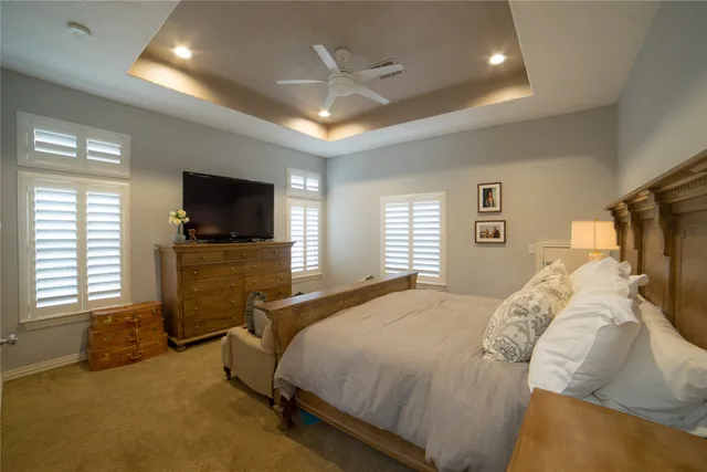 a living room with a couch and a chandelier