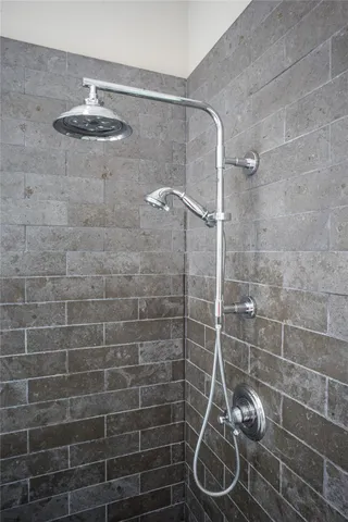 a bathroom with a granite countertop sink mirror and cabinets