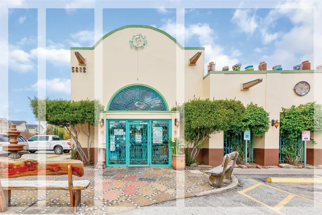 a view of a building with a street