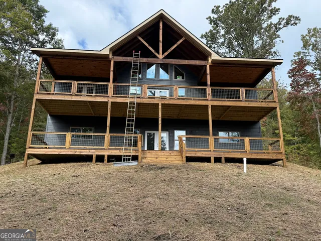 a front view of house with deck