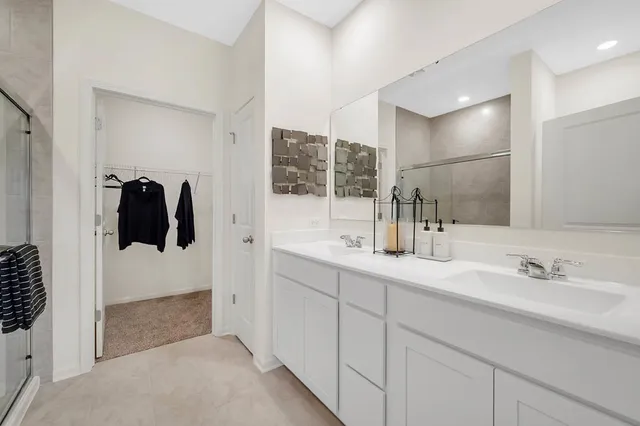 a bathroom with a sink and mirror